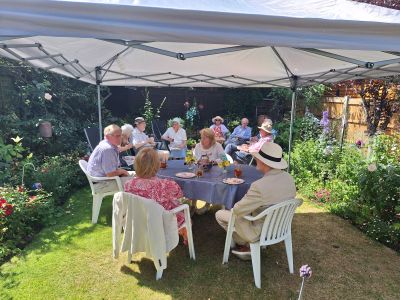 Friends attending the informal annual summer garden party.