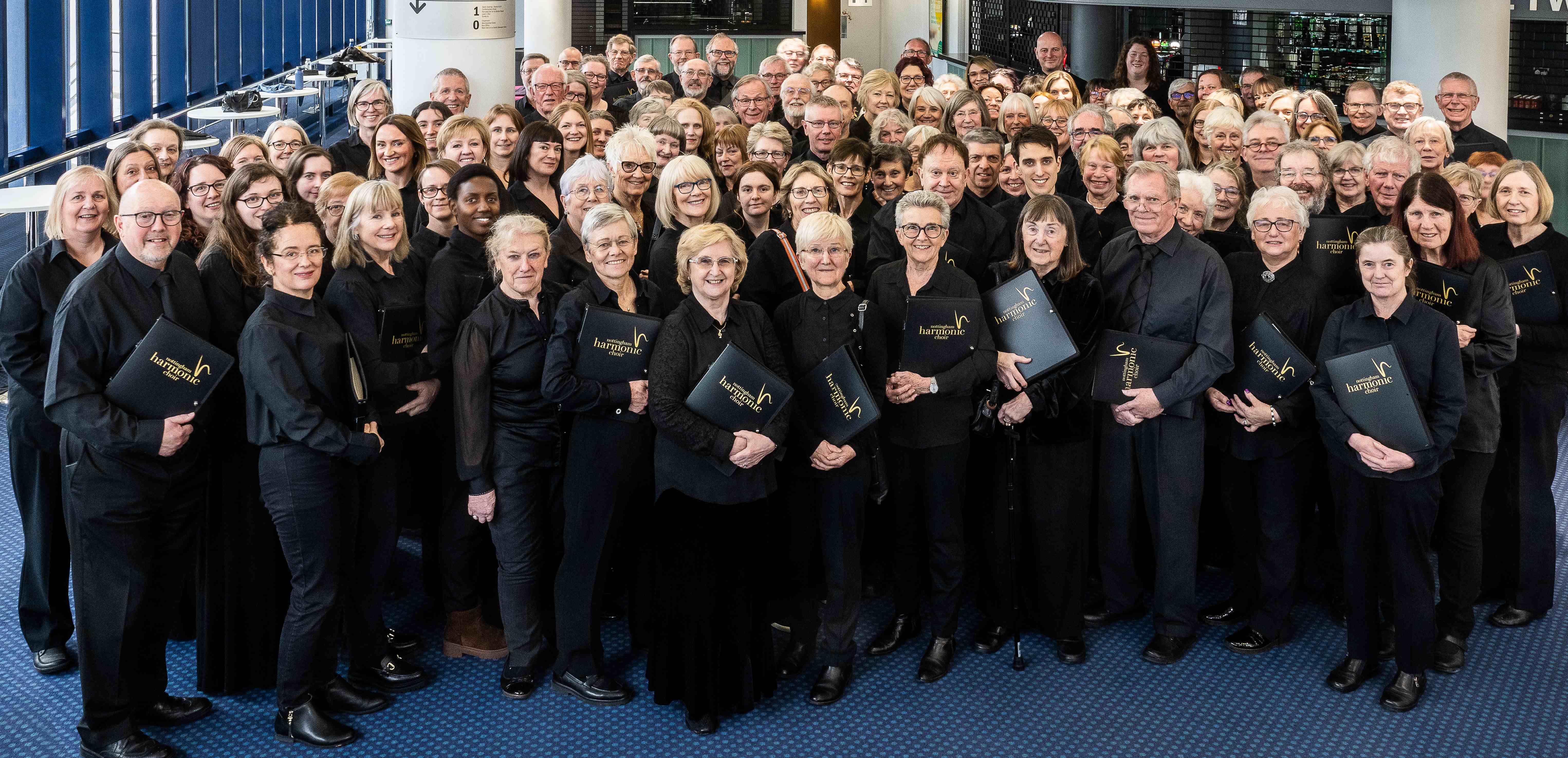 The choir photographed in the foyer of The Royal Concert Hall, Nottingham.